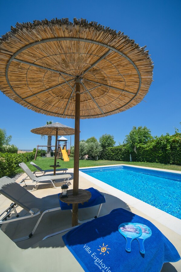 Outdoor pool, pool umbrellas, sun loungers
