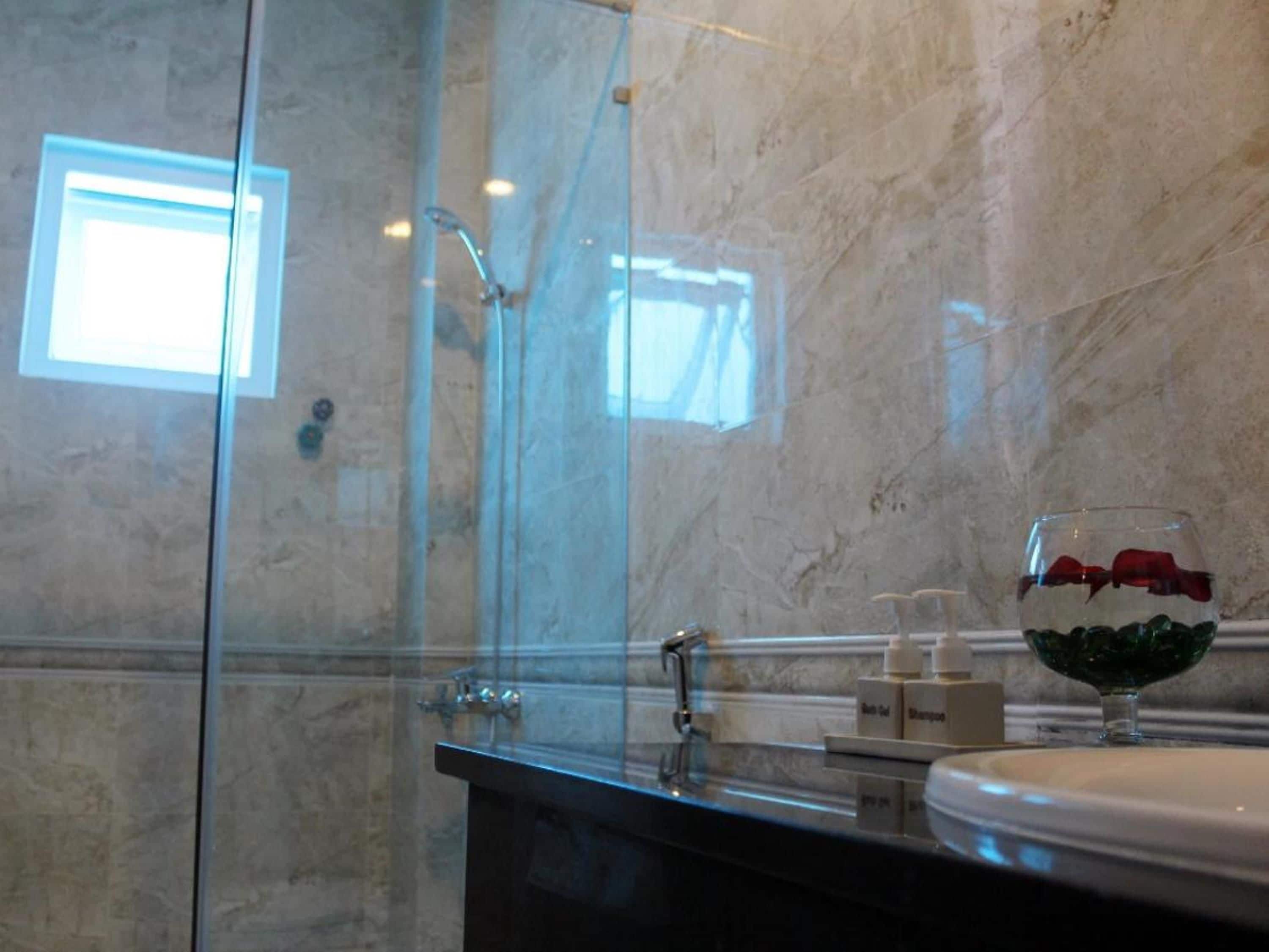 Shower, free toiletries, hair dryer, slippers