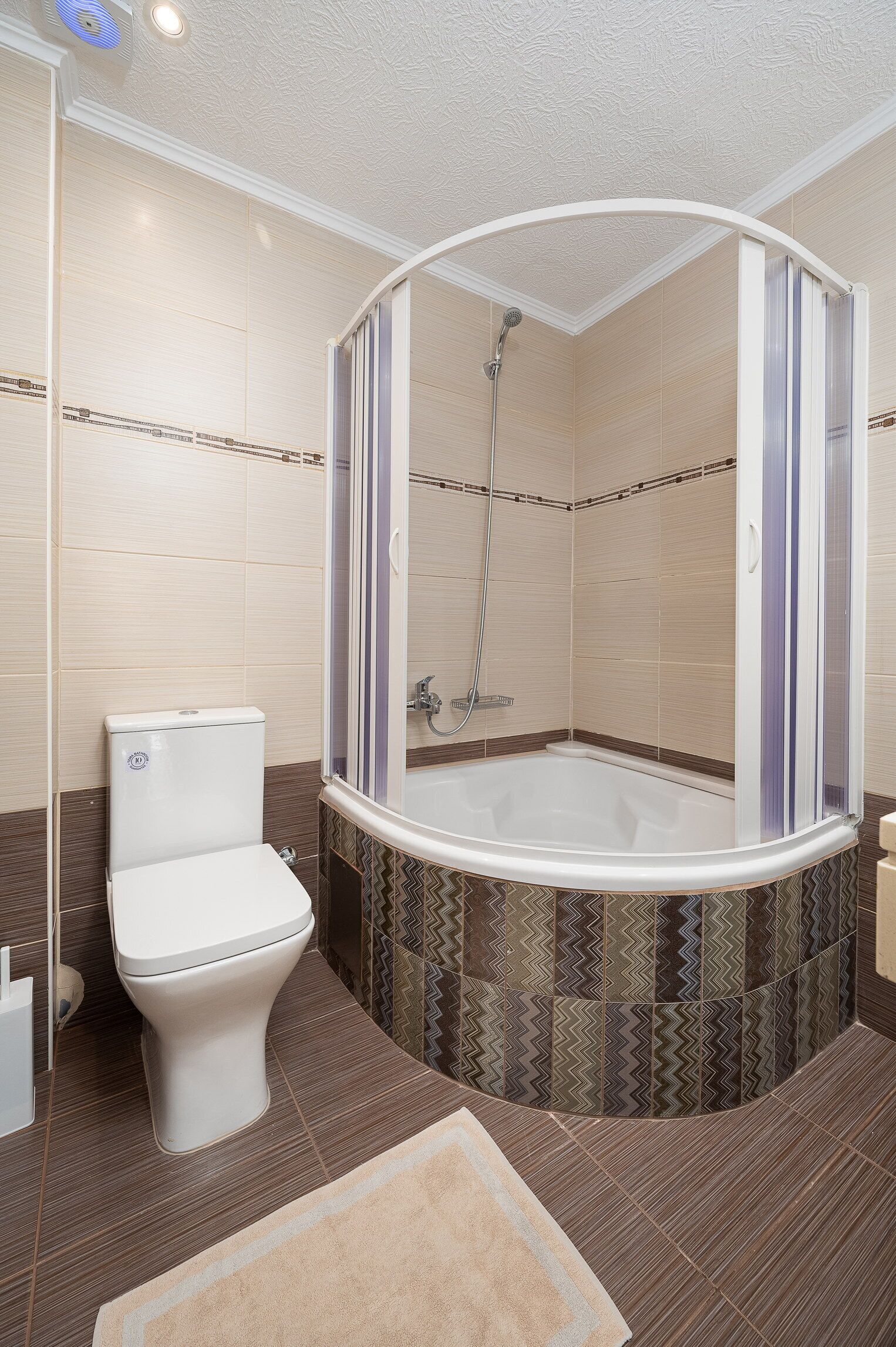 designer toiletries, hair dryer, bathrobes, slippers