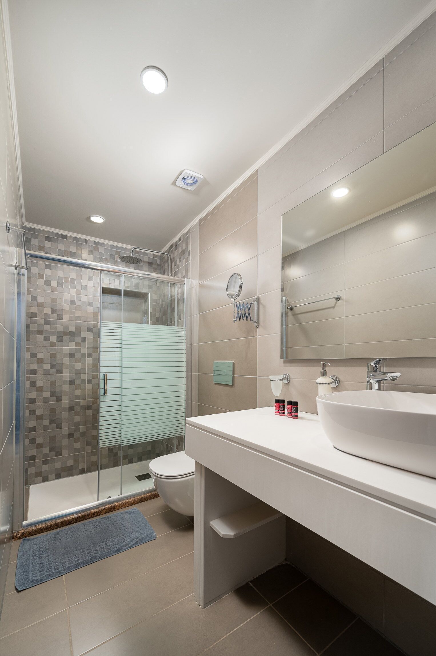 designer toiletries, hair dryer, bathrobes, slippers