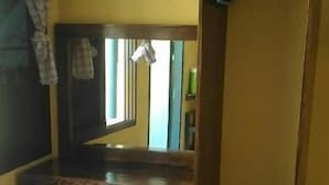 A room with a wooden desk, a mirror, and a wardrobe. - Island Lodge (Ko Chang)