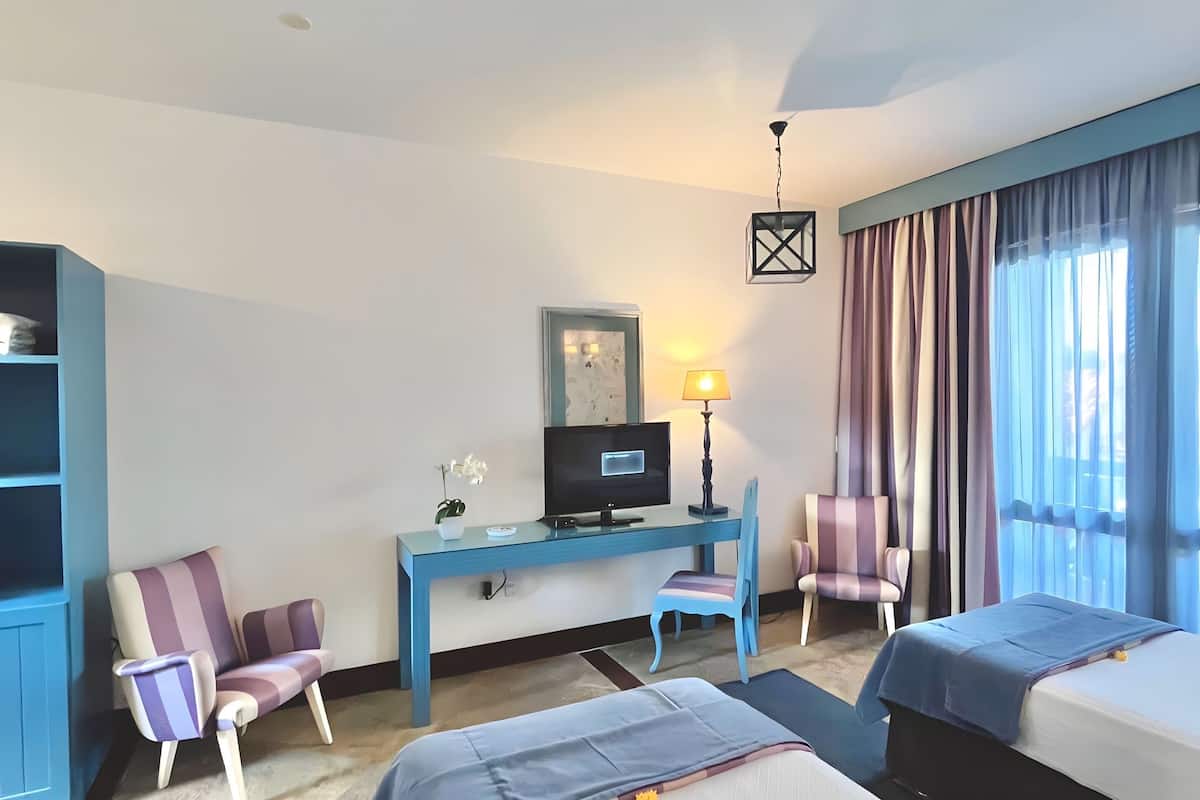 comfort twin room | minibar, individually decorated, desk, blackout curtains