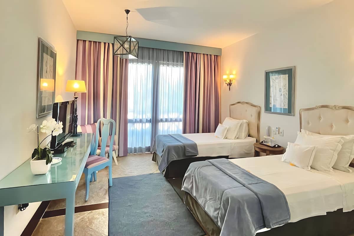 comfort twin room | minibar, individually decorated, desk, blackout curtains