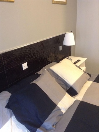 Double or Twin Room | Desk, blackout drapes, free WiFi