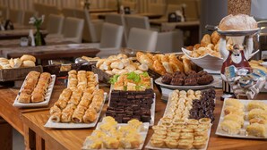 A buffet table with various pastries and baked goods. -  Transamerica Executive Macaé (Macaé)