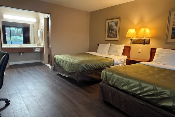 Premium bedding, desk, laptop workspace, iron/ironing board