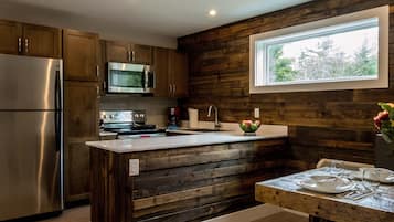 Deluxe One Bedroom | Private kitchen | Full-size fridge, microwave, oven, stovetop