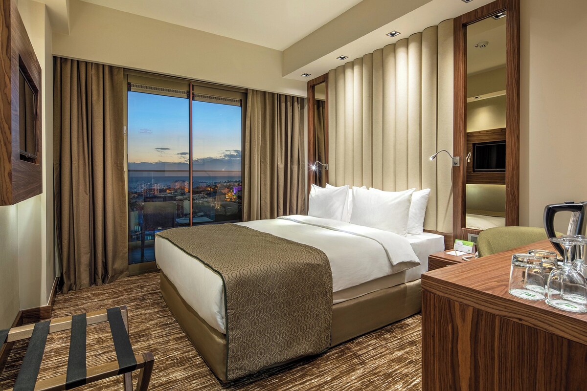Premium bedding, minibar (some free items), in-room safe, desk