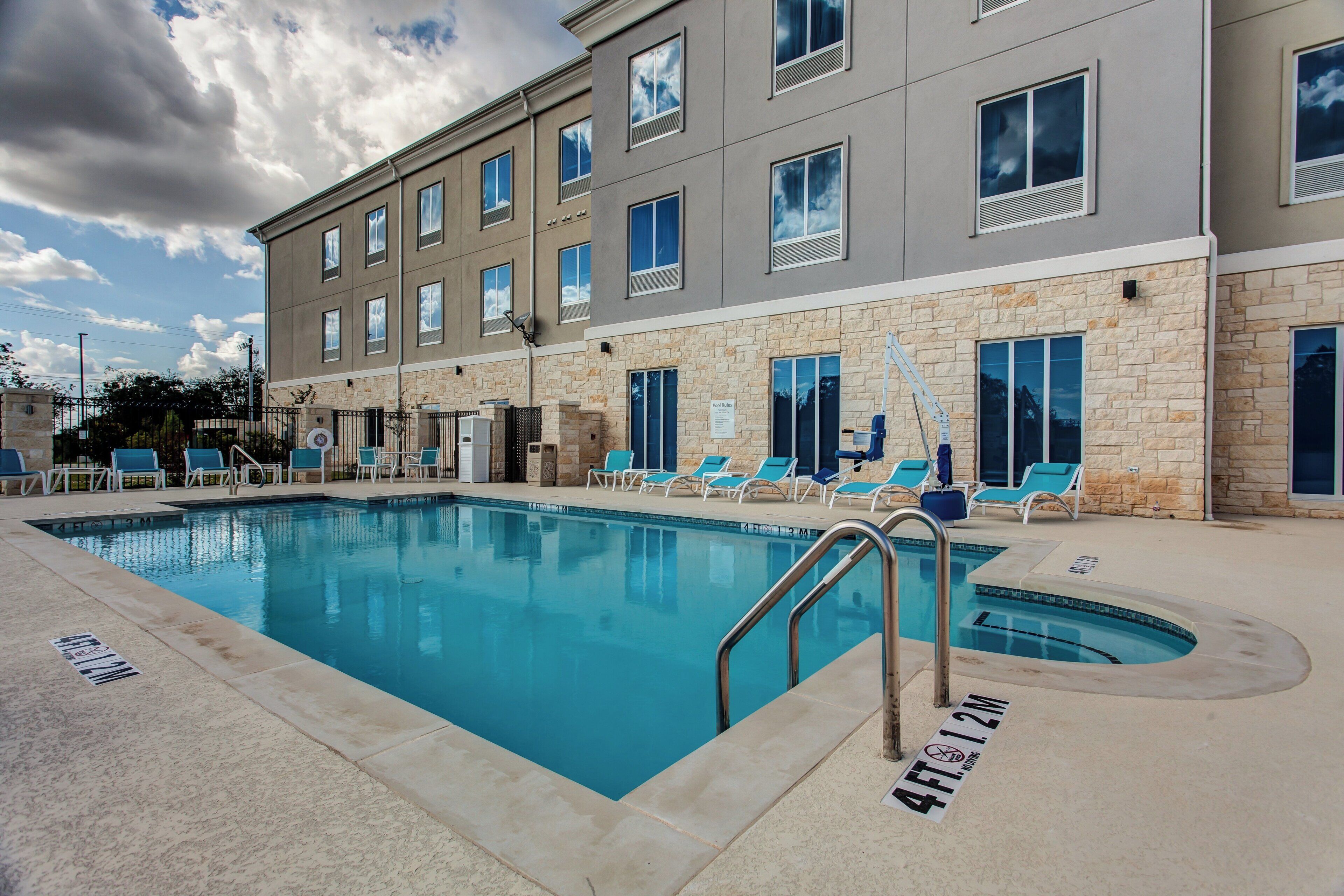 Outdoor pool, open 10:00 AM to 10:00 PM, pool loungers