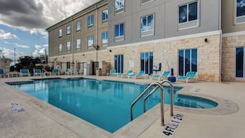 Outdoor pool, open 10:00 AM to 10:00 PM, pool loungers