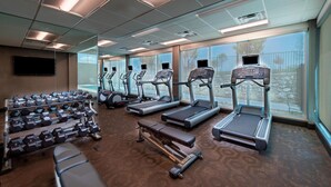 A gym with treadmills, dumbbells, and a bench. - Fairfield Inn & Suites by Marriott Dallas Waxahachie (Waxahachie)