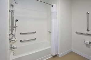 Enjoy a refreshing shower or soak in the bathtub, complete with a handheld and rain showerhead.