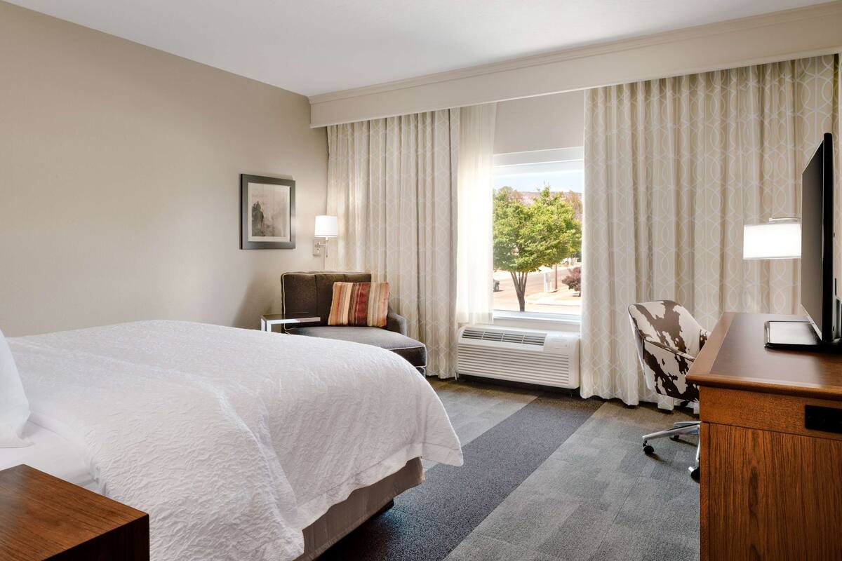 desk, laptop workspace, blackout curtains, iron/ironing board