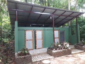 Castaway room with Twin bed | Bathroom | Hair dryer, towels, soap, shampoo