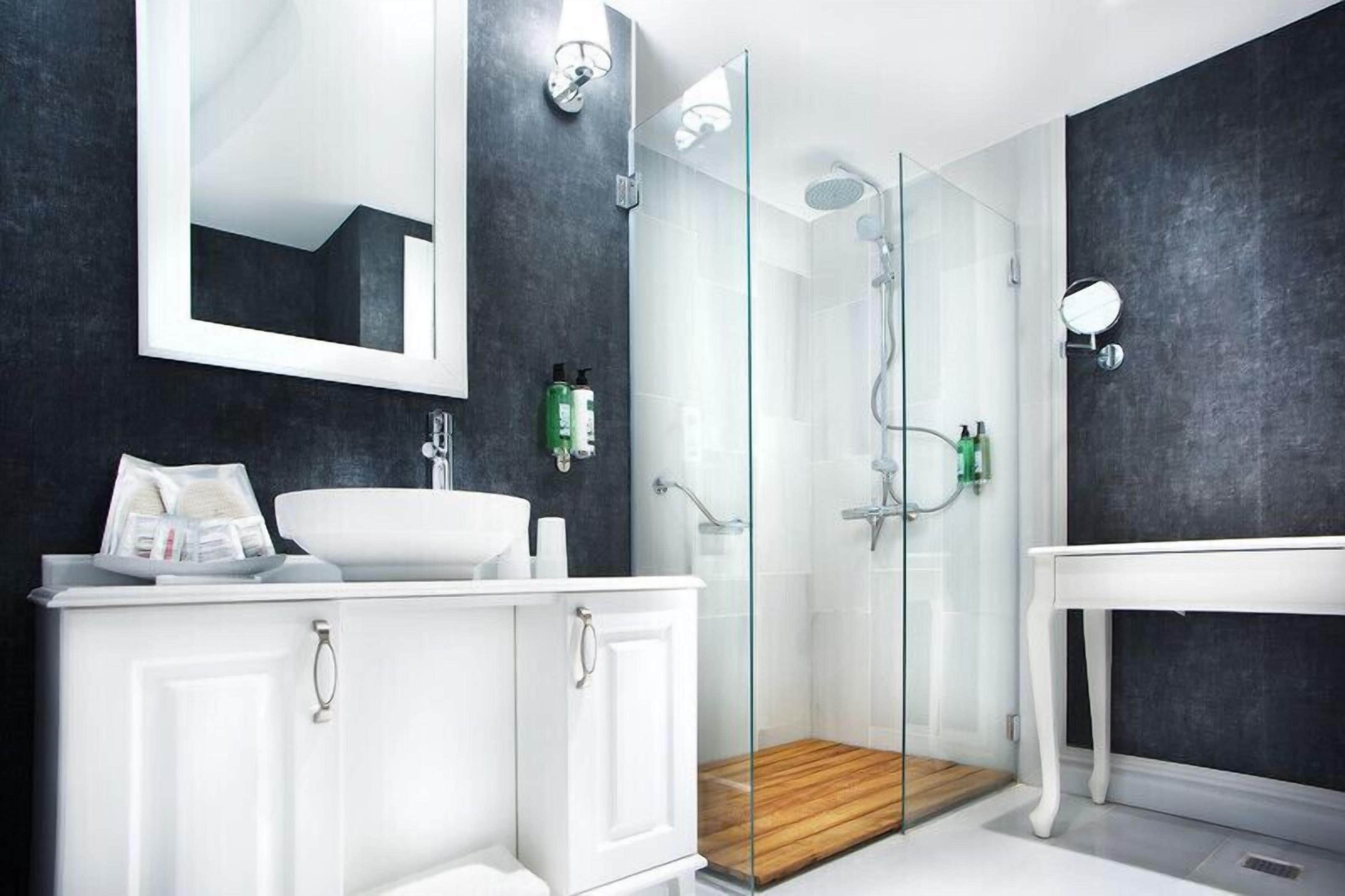 standard double room | bathroom | shower, designer toiletries, hair dryer, bathrobes