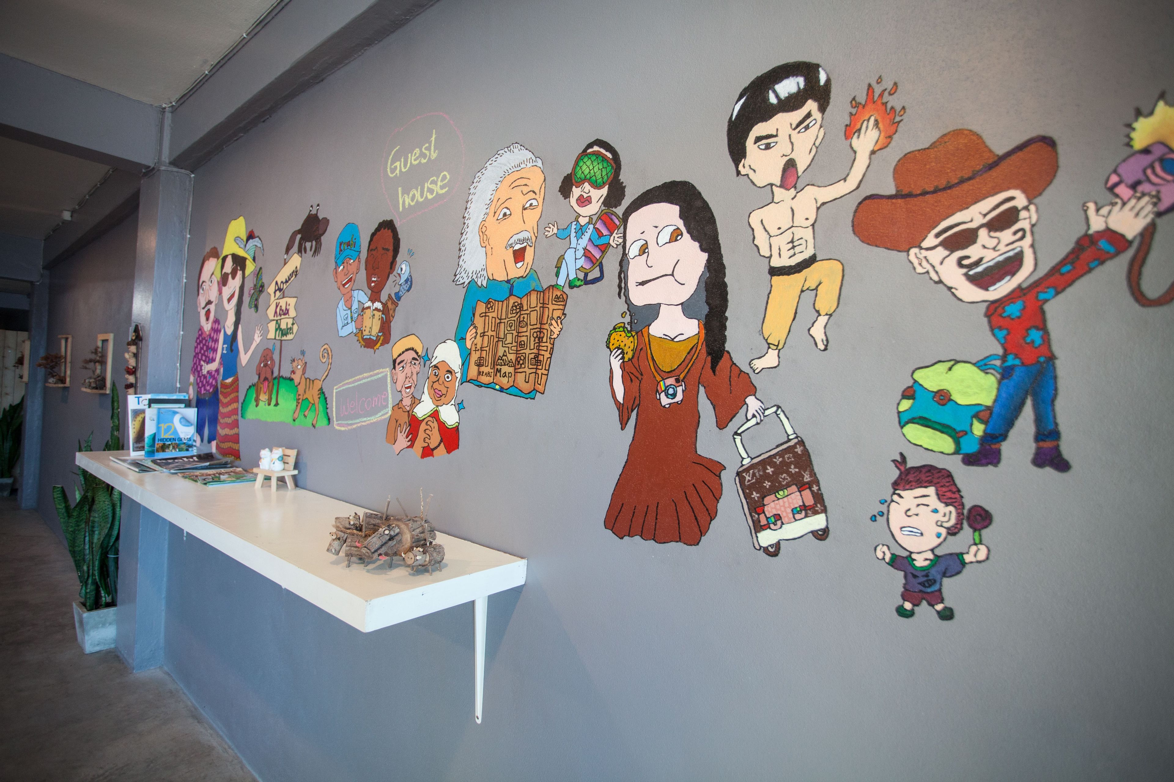 A wall with cartoon characters and a reception desk.