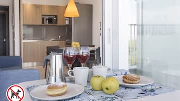 Prestige Apartment, 1 Bedroom | Private kitchen | Stovetop, cookware/dishes/utensils, dining tables