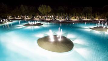 Seasonal outdoor pool, open 9:00 AM to 9:00 PM, pool umbrellas