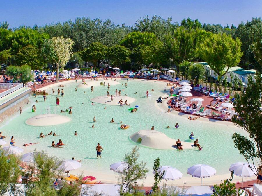 Seasonal outdoor pool, open 9:00 AM to 9:00 PM, pool umbrellas