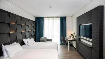 Premium bedding, free minibar, in-room safe, desk