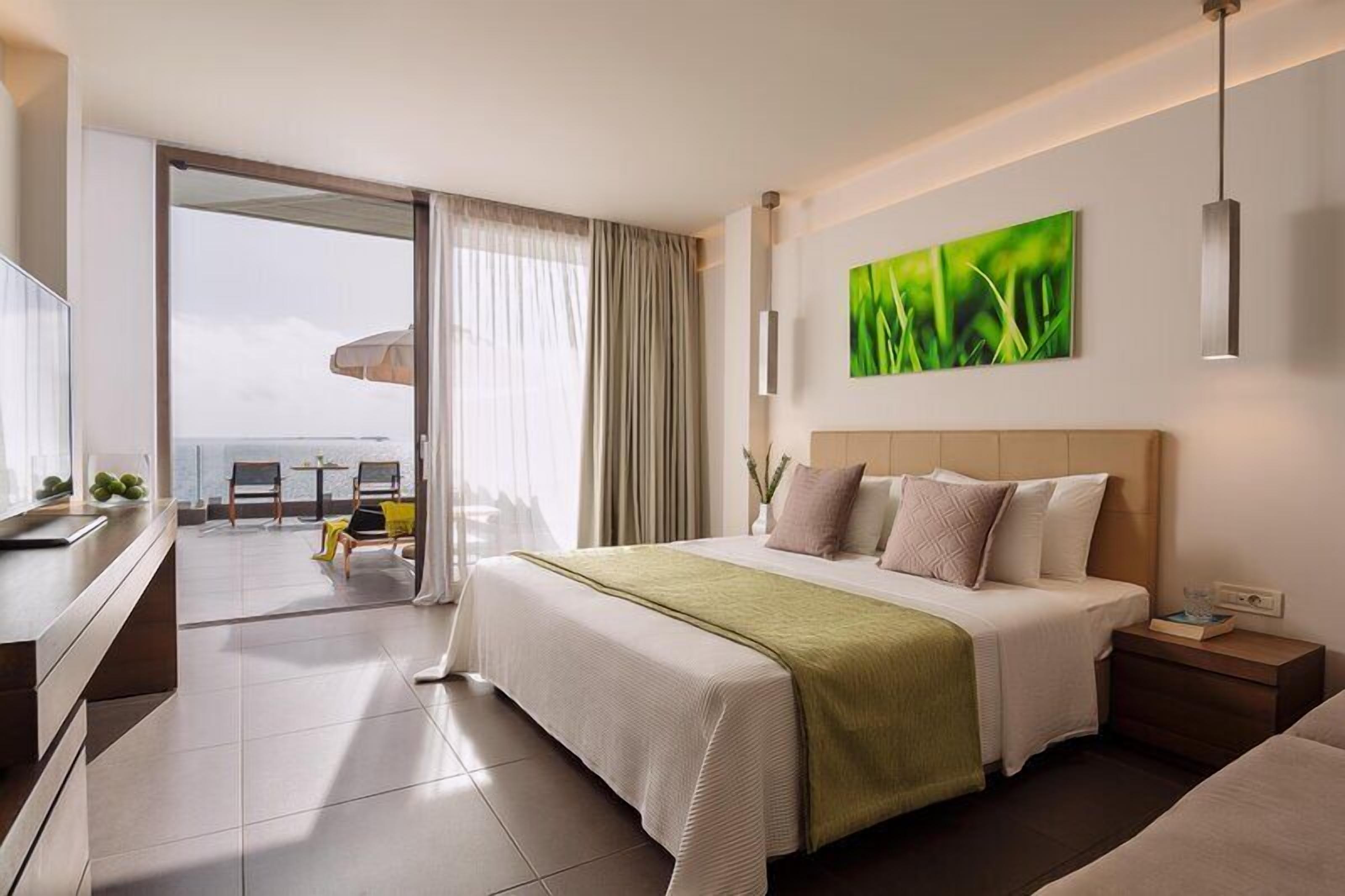 Bungalow, Sea Facing (Seafront) | Minibar, in-room safe, desk, laptop workspace