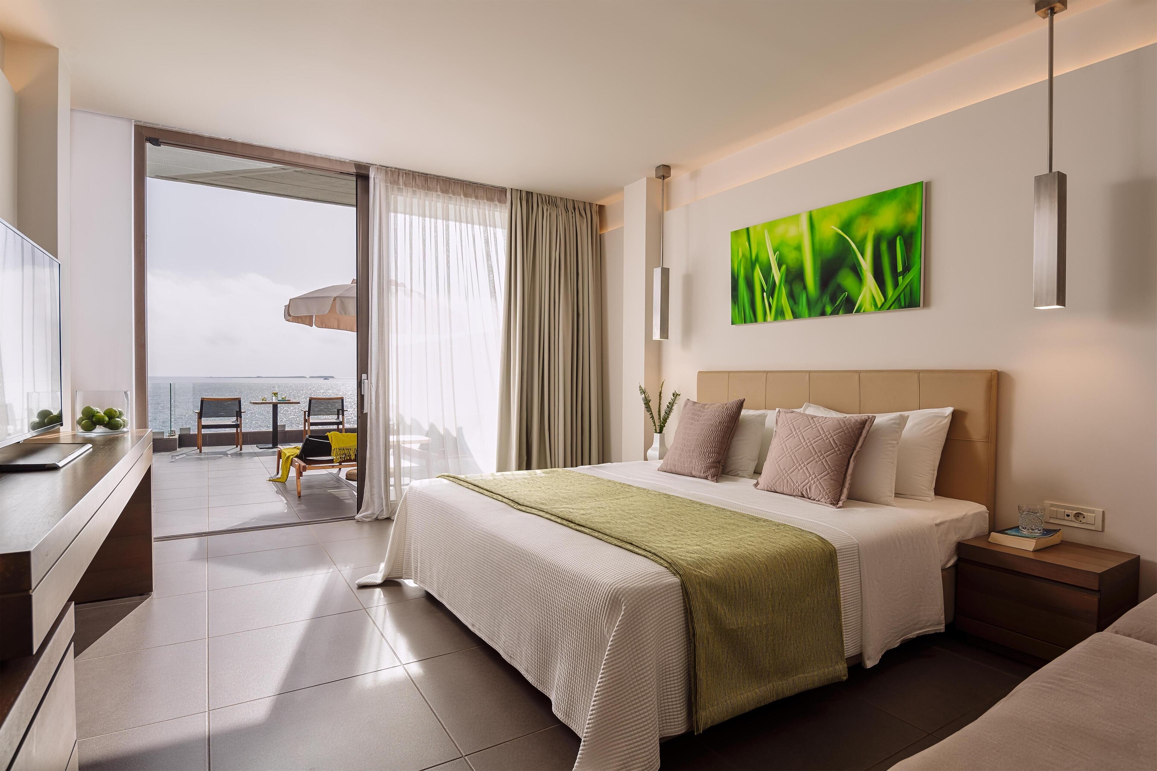 Bungalow, Sea Facing (Seafront) | Minibar, in-room safe, desk, laptop workspace