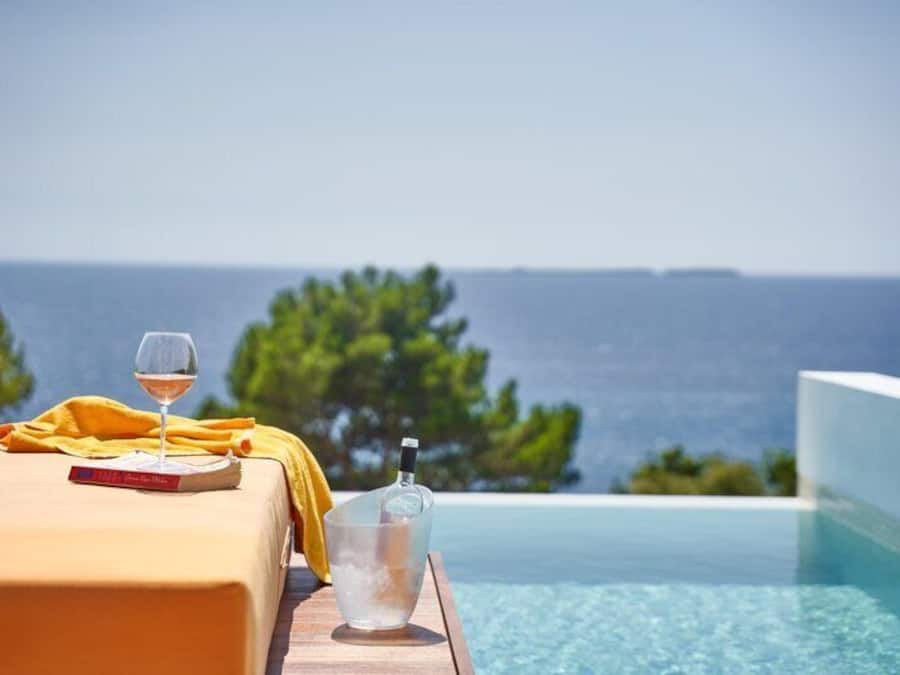 Outdoor pool, open 9 AM to 7 PM, pool umbrellas, sun loungers