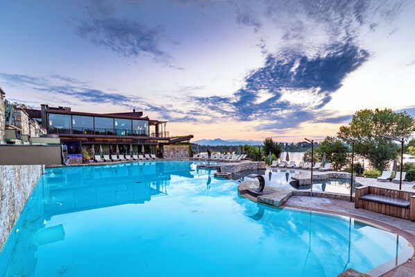 Seasonal outdoor pool, pool umbrellas, pool loungers