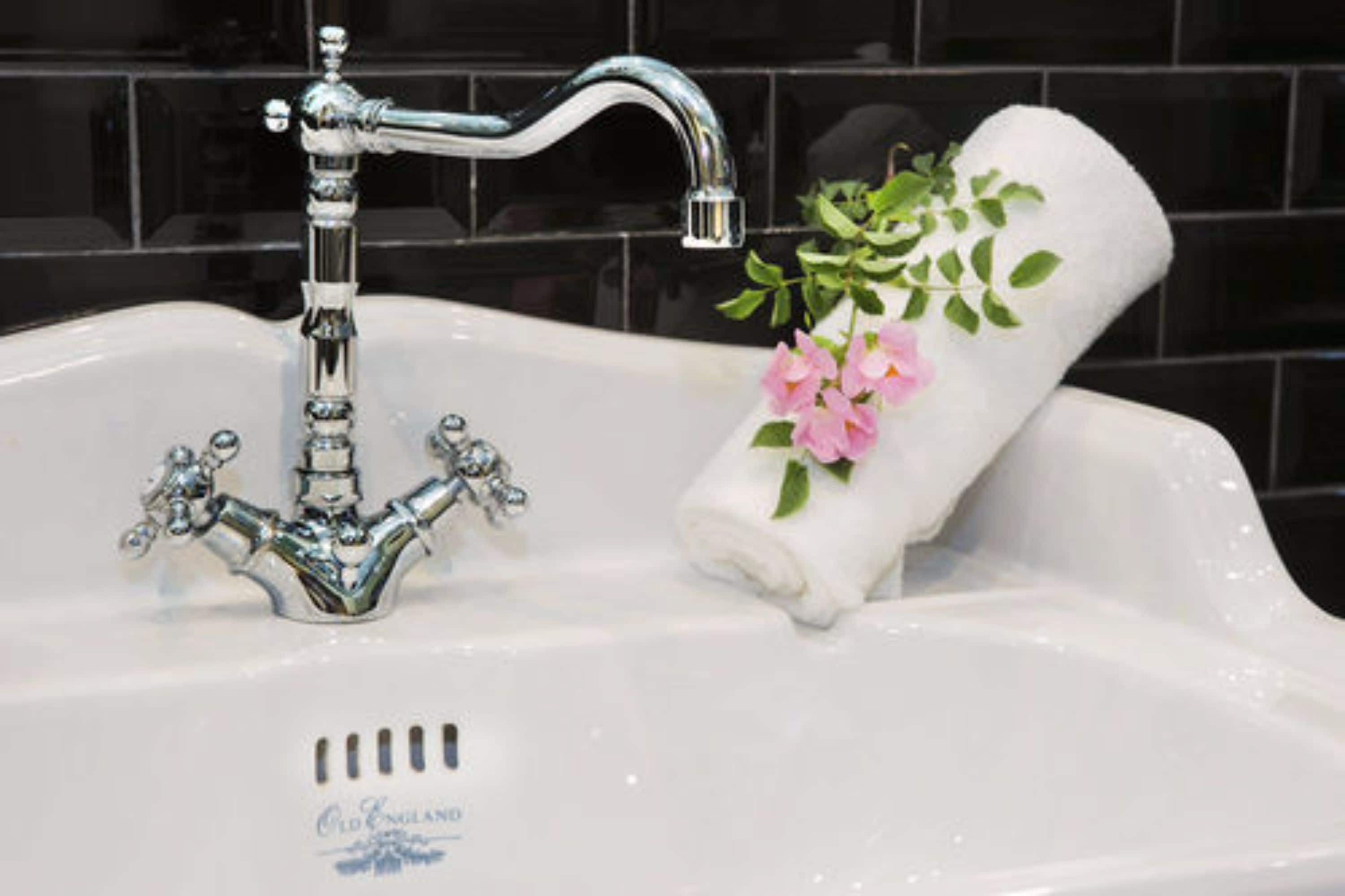 deluxe quadruple room | bathroom | shower, free toiletries, hair dryer, bathrobes