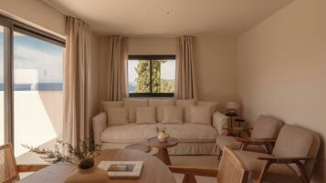 Deluxe Suite, Balcony, Sea View | Living area | Flat-screen TV