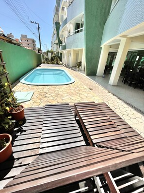 Seasonal outdoor pool, open 8:00 AM to 8:00 PM, pool umbrellas