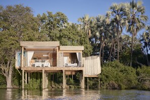 Island Treehouse | Premium bedding, free minibar, in-room safe, desk - Victoria Falls River Lodge (Victoria Falls)