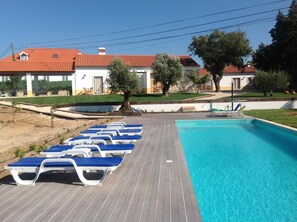 Outdoor pool, pool umbrellas, sun loungers