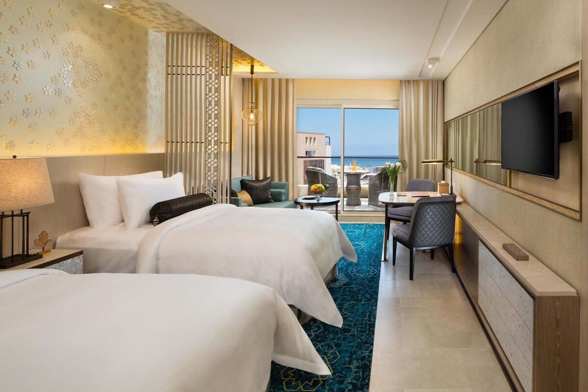 Premium bedding, pillow-top beds, free minibar, in-room safe