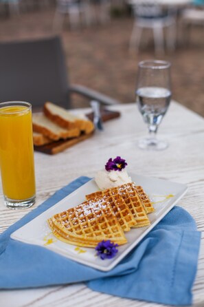 Breakfast, lunch, dinner served; local cuisine, al fresco dining