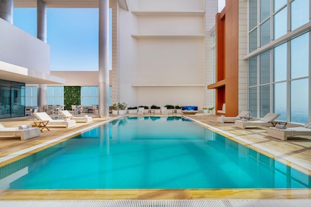 Outdoor pool, pool loungers. Marriott Hotel Downtown, Abu Dhabi