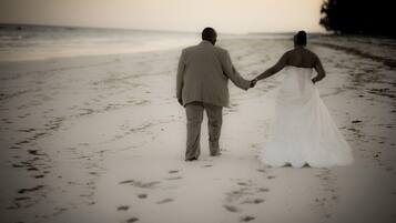 Couples can stroll hand in hand along the wide, open beach.