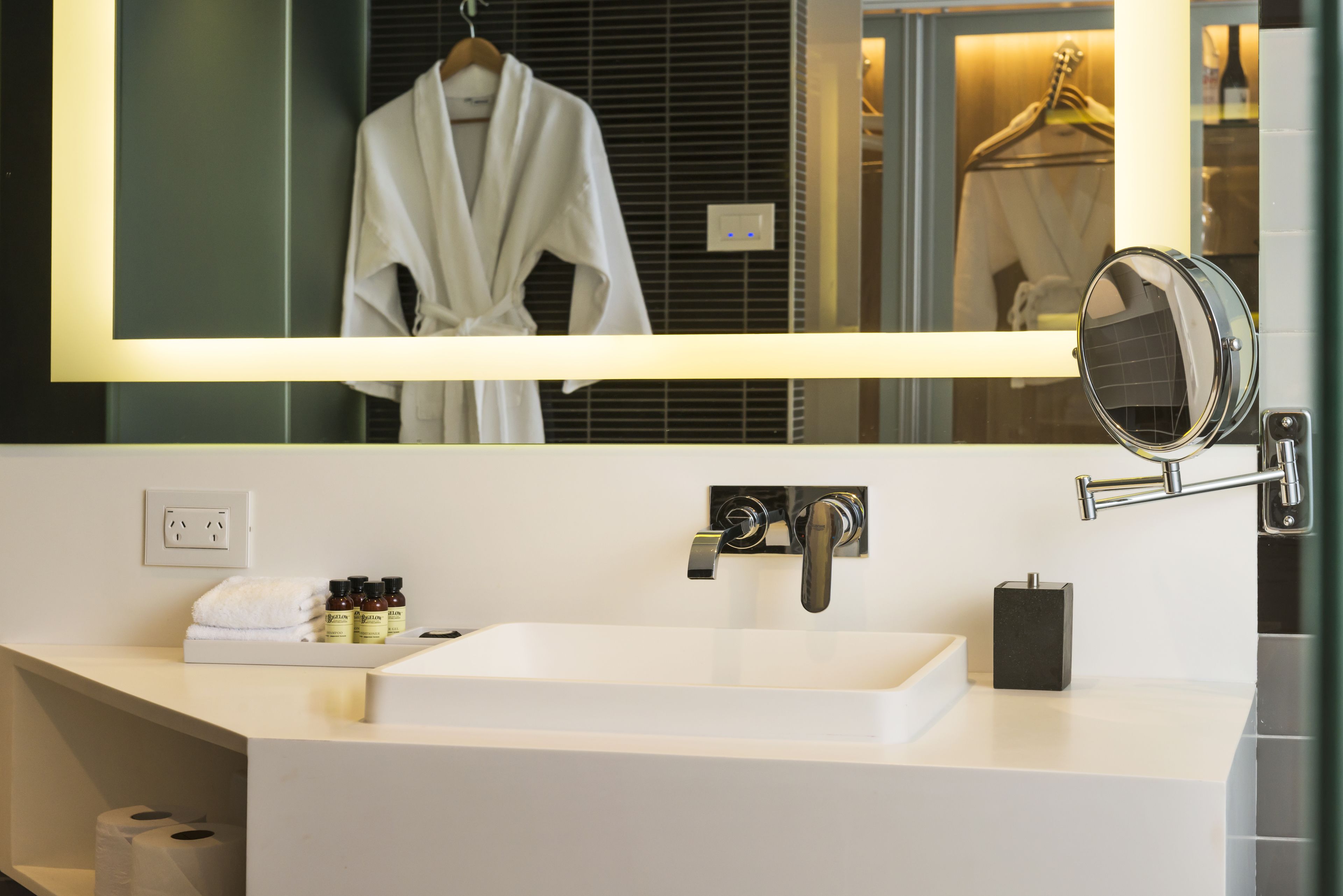 designer toiletries, hair dryer, bathrobes, slippers