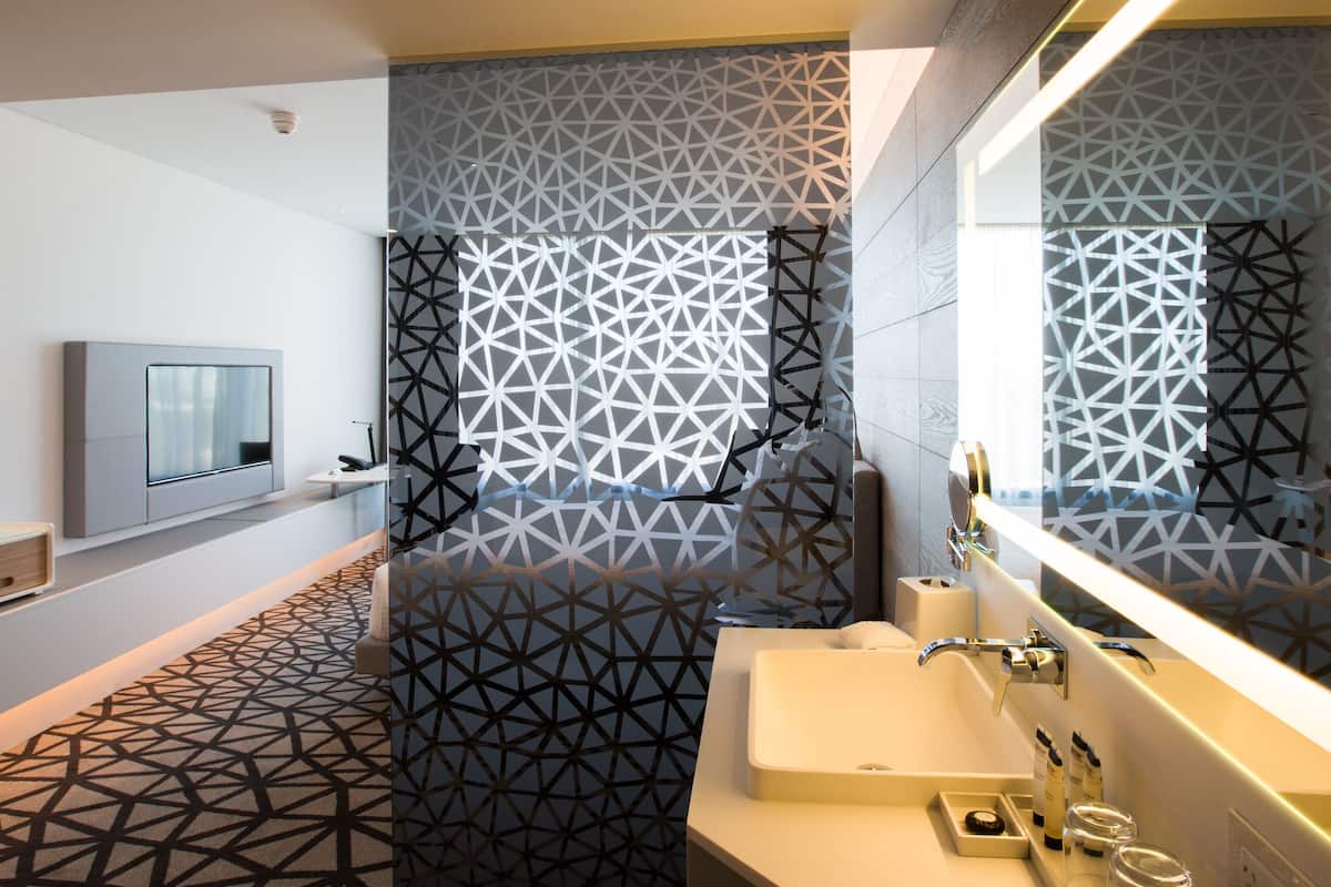 designer toiletries, hair dryer, bathrobes, slippers