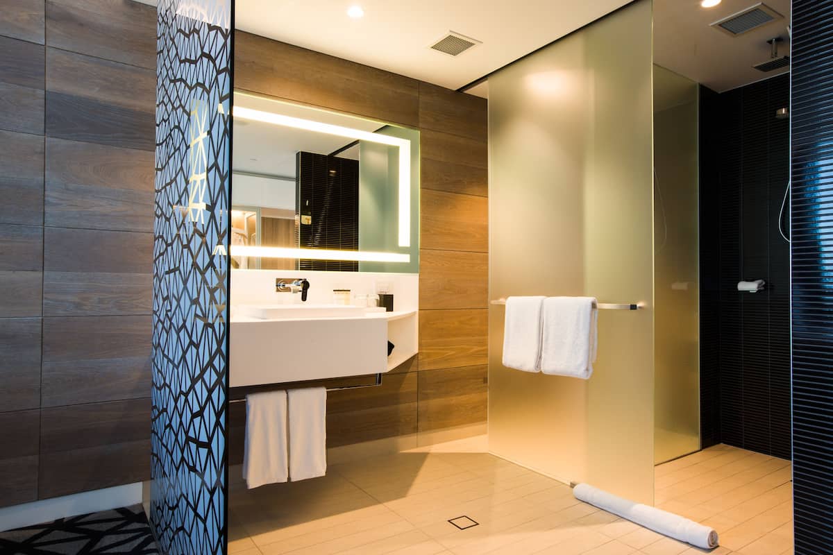 designer toiletries, hair dryer, bathrobes, slippers