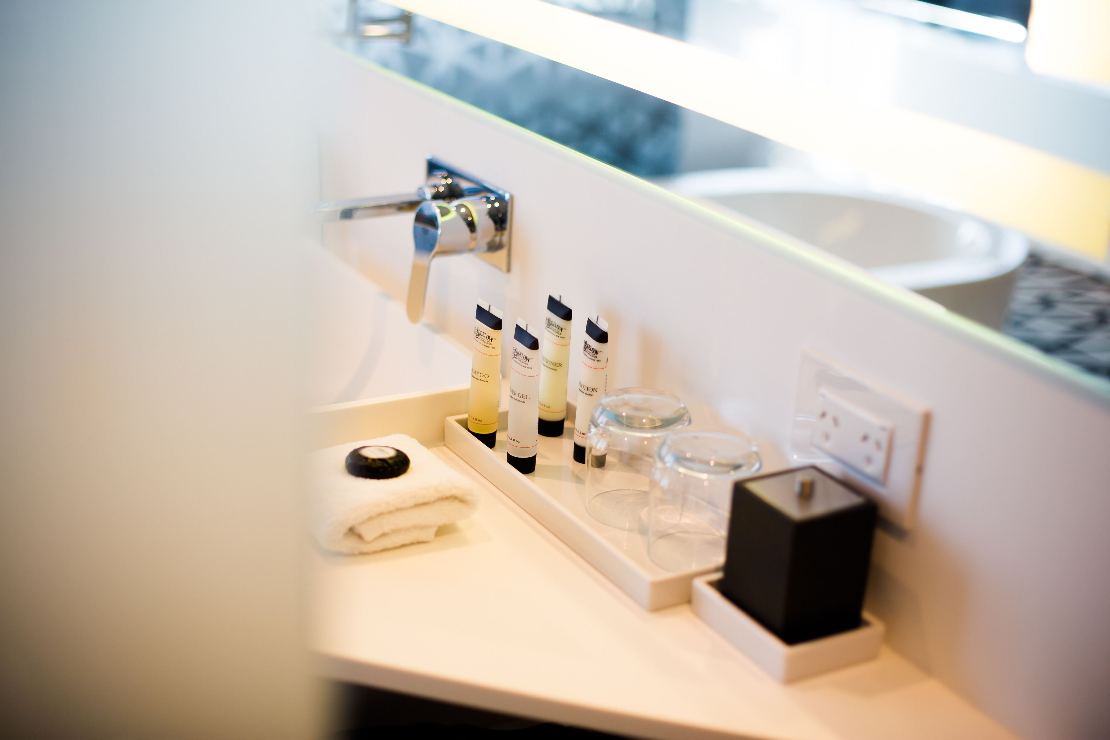 designer toiletries, hair dryer, bathrobes, slippers