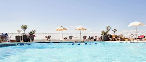 Seasonal outdoor pool, pool umbrellas, pool loungers