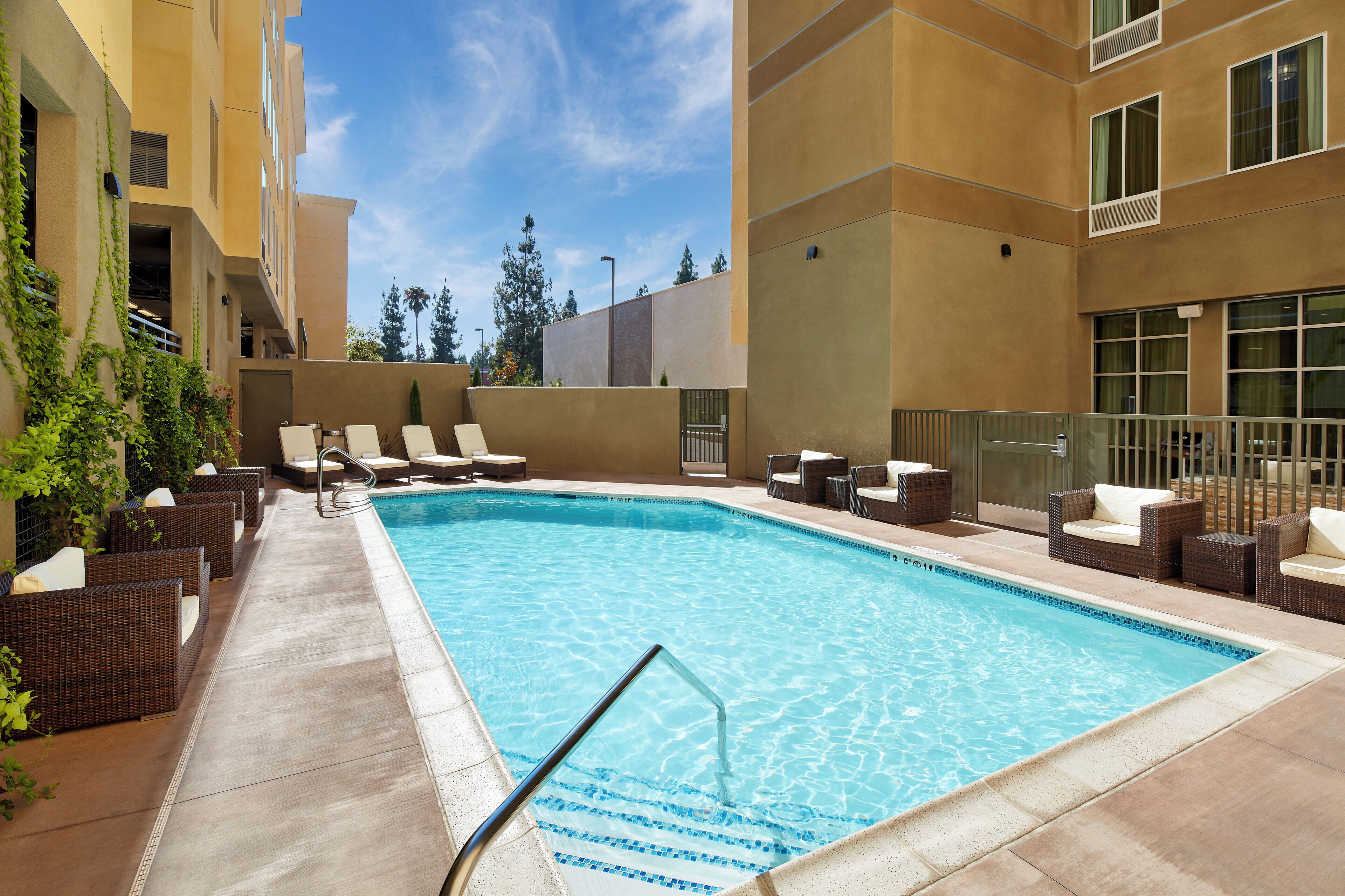 Outdoor pool, open 7:00 AM to 10:00 PM, sun loungers