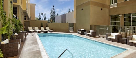 Outdoor pool, open 7:00 AM to 10:00 PM, pool loungers