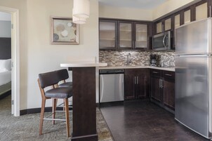 Full-size fridge, microwave, coffee/tea maker, cookware/dishes/utensils