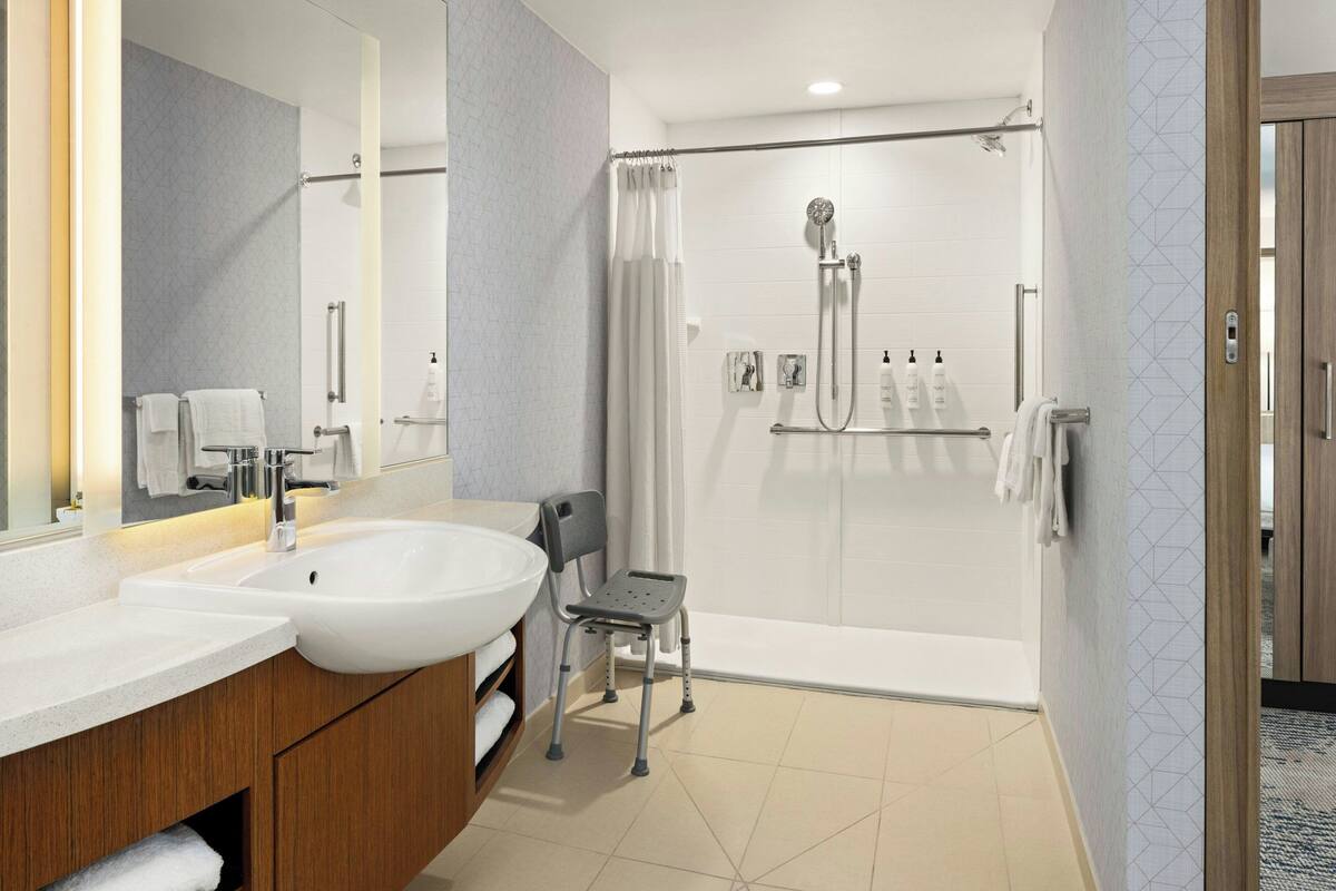 Designer toiletries, hair dryer, towels, soap