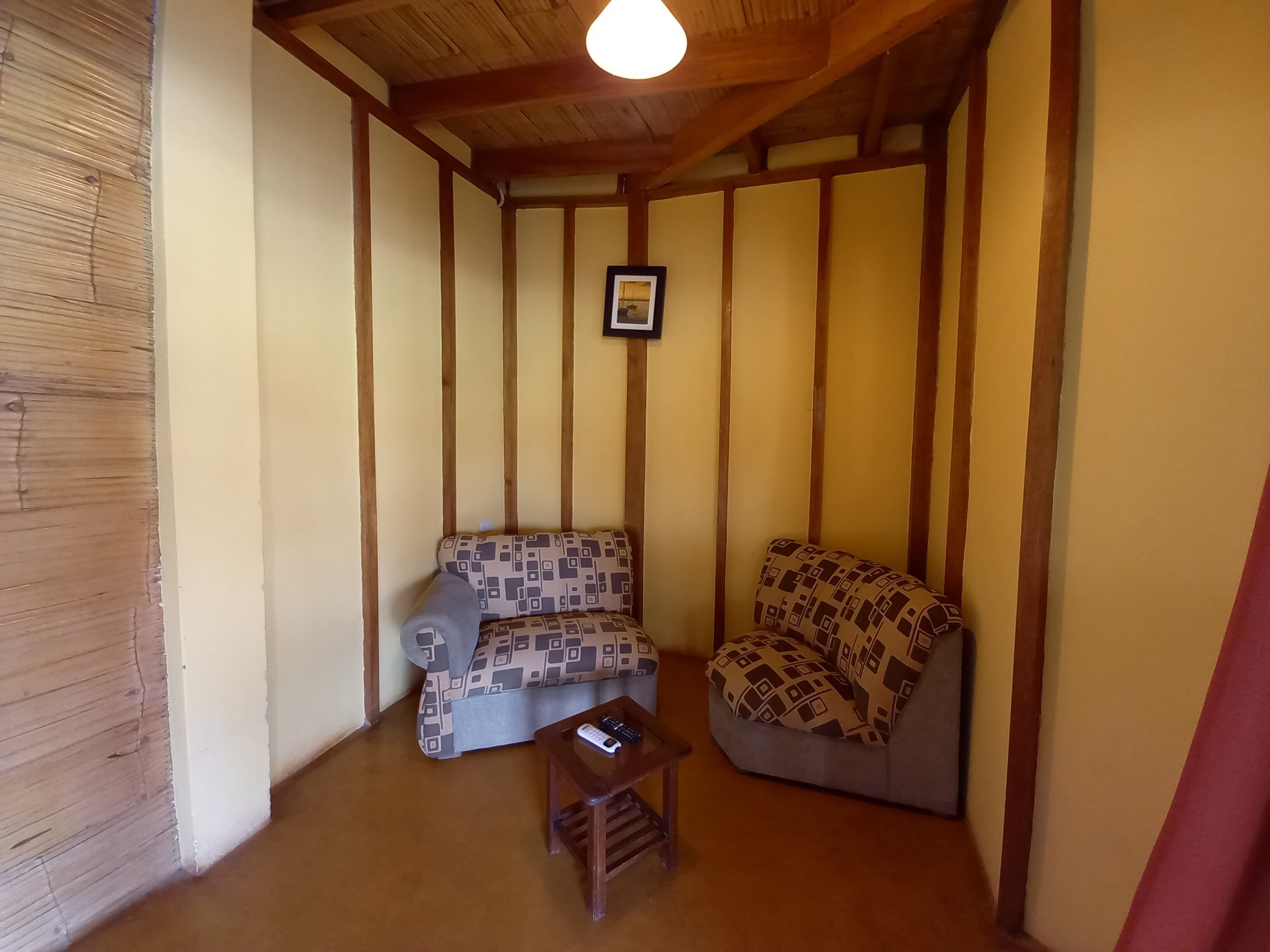 quadruple room, terrace, pool view | living area | flat-screen tv