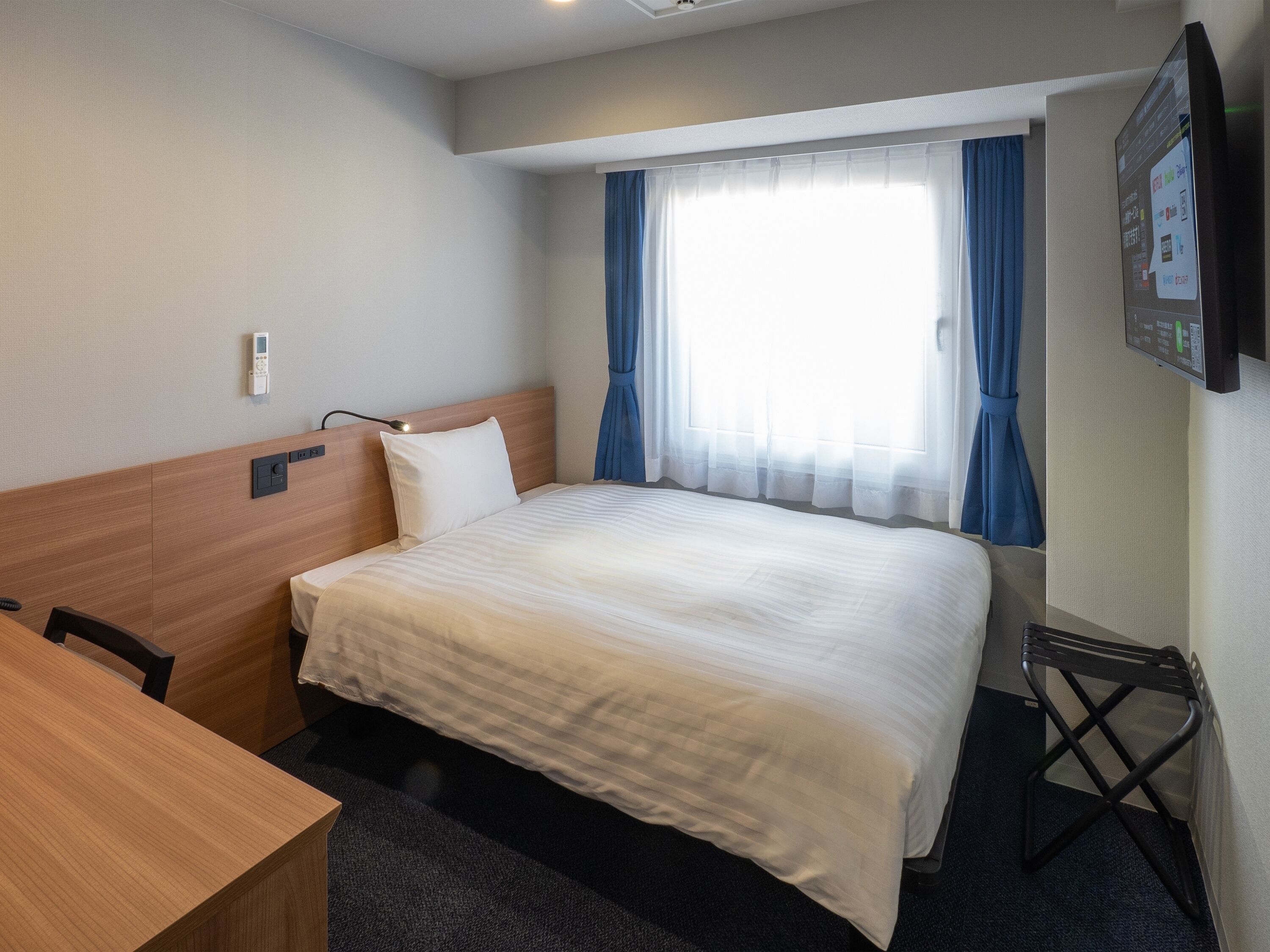 Desk, laptop workspace, free WiFi, bed sheets