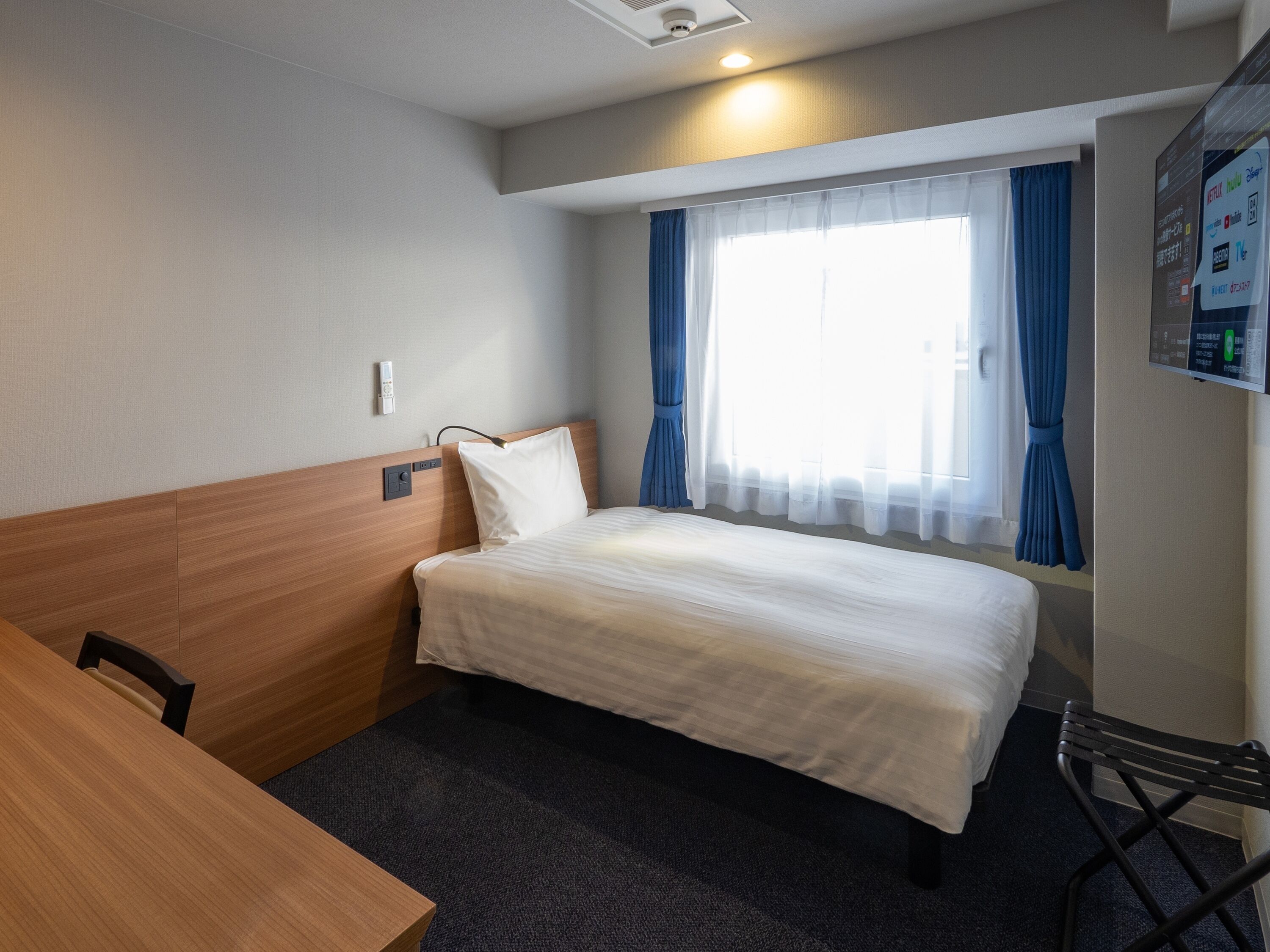 Desk, laptop workspace, free WiFi, bed sheets