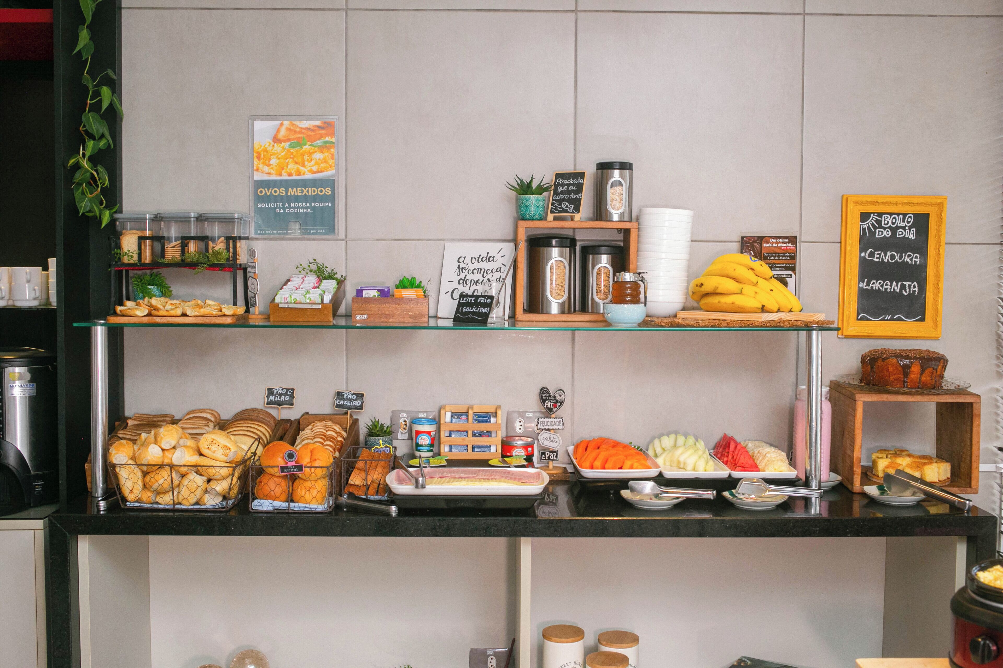 A breakfast buffet with various food items and beverages.